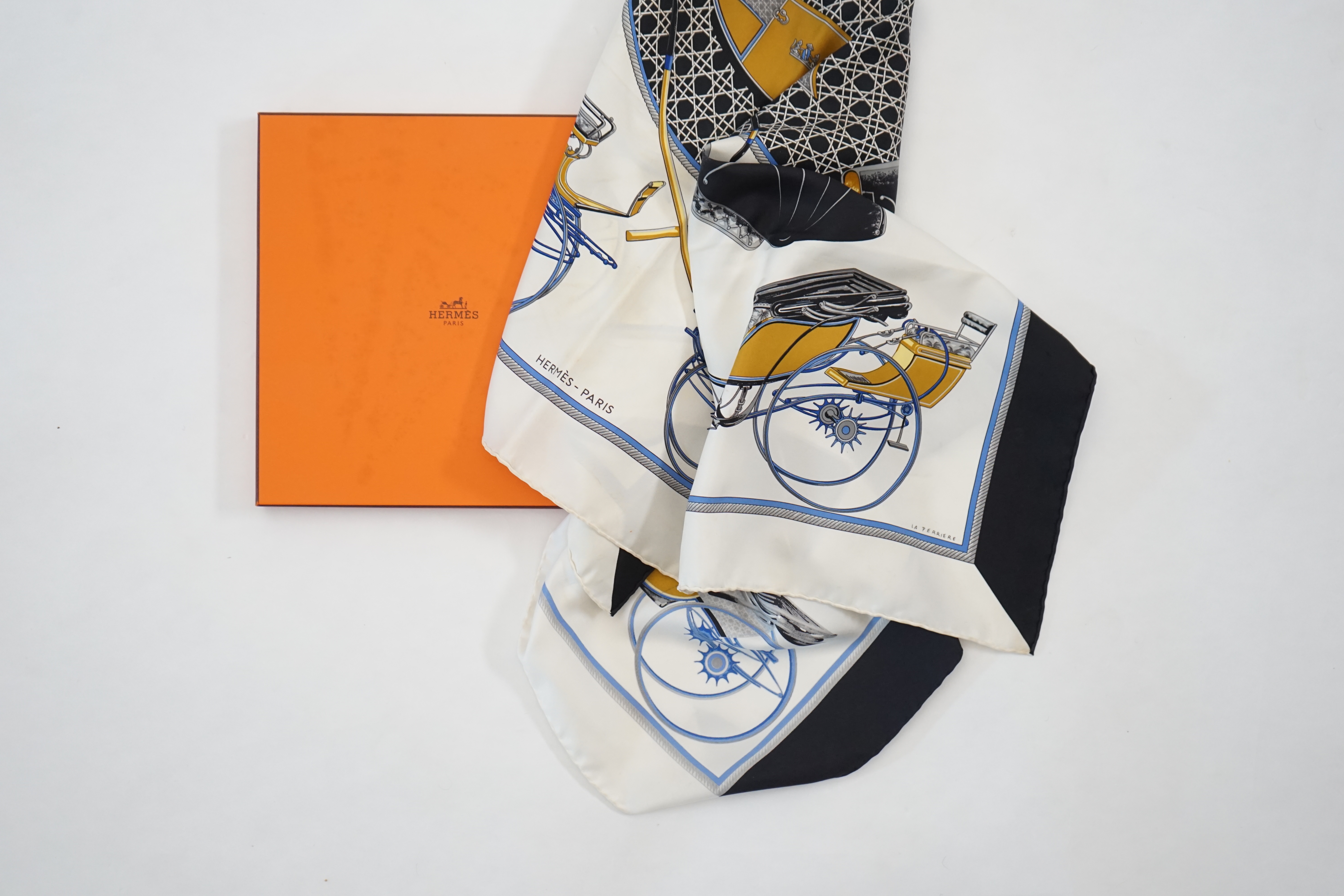 A Hermès Les Voitures a Transformation by Francoise de la Perriere black and white silk scarf, approx 90cm x 90cm